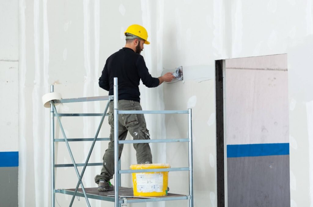 worker plastering gypsum board wall 2025 03 23 20 47 49 utc